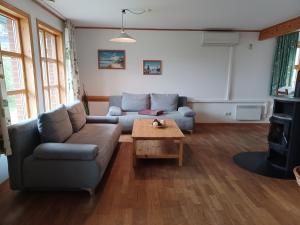 a living room with a couch and a coffee table at Heideröschen Park Heideröschen 9a in Zingst