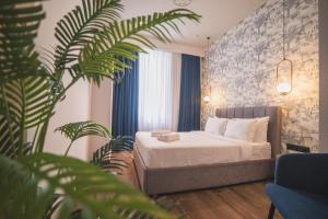 Postel nebo postele na pokoji v ubytování Downtown Suites by Athens Tower
