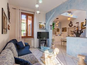 a living room with a couch and a table at Holiday Home Valentina by Interhome in Porto Ceresio