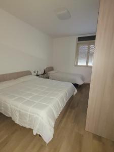 Postel nebo postele na pokoji v ubytování HOUSE AIRPORT Catania