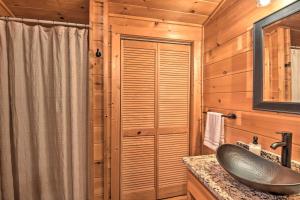 a bathroom with a sink and a shower in a cabin at Blue Ridge Cabin Hot Tub, Fire Pit and Grill! in Blue Ridge +19 photos