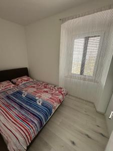 Postel nebo postele na pokoji v ubytování Apartman Mia