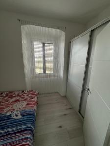 Postel nebo postele na pokoji v ubytování Apartman Mia