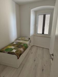 Postel nebo postele na pokoji v ubytování Apartman Mia