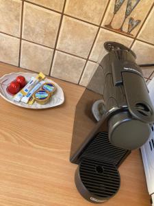 a knife sitting on a table next to a plate of food at Sunny Athens Apartment in Athens