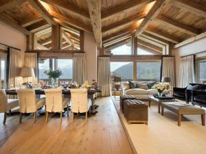 a large living room with a table and a couch at Luxury Apartment in Crans Montana by Dieckereise in Crans-Montana