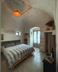a bedroom with a large bed in a room at La Mia Lamia in Cisternino