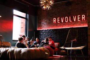 a group of people sitting in a room at Revolver in Glasgow