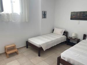 Postel nebo postele na pokoji v ubytování Cycladic home in Kounados Paros