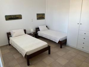 Postel nebo postele na pokoji v ubytování Cycladic home in Kounados Paros