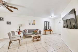 a living room with a couch and a table at Pet-Friendly Edinburg Townhome - Near Stadiums! in Edinburg