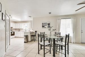 a kitchen and dining room with a table and chairs at Pet-Friendly Edinburg Townhome - Near Stadiums! in Edinburg