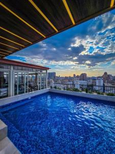 a swimming pool on the roof of a building at Mar Charbel Hotel Cairo in Cairo