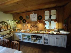 a kitchen with a counter with food on it at Stary Młyn w Brzeźnicy in Brzeźnica
