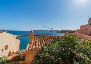 a view of the ocean from a building at PGS IMMOBILIARE SRLS – Pagello D – Trilocale vista mare– La Maddalena in Casale Azara