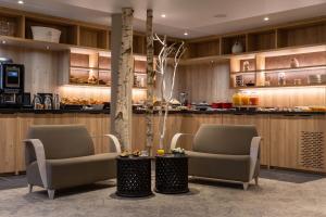 Posezení v ubytování Hôtel Lancelot & Spa - Domaine du Roi Arthur
