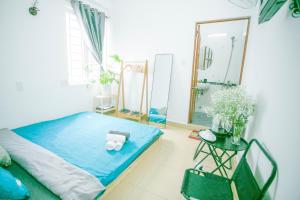 Postel nebo postele na pokoji v ubytování Pearl Wealth Dalat Hotel