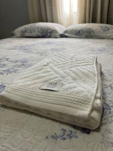 Ένα ή περισσότερα κρεβάτια σε δωμάτιο στο 2 Quartos Aconchegante - Cohama