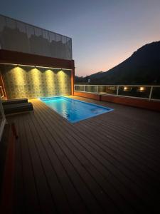 a swimming pool on the roof of a building at Summer House Nandi Foothills in Nandi