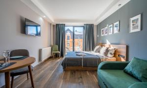 Postel nebo postele na pokoji v ubytování New Gudauri Apartments