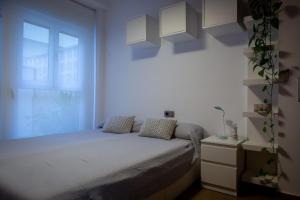 Patacona Sunrises Premium tesisinde bir odada yatak veya yataklar