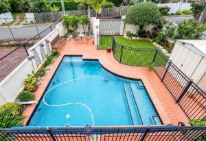 an overhead view of a swimming pool on a building at Seaside Serenity at Plumeria Place in Brisbane