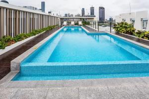 a swimming pool on the roof of a building at Urban Luxury - Discover this City Escape in Brisbane