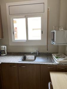 Kuchyň nebo kuchyňský kout v ubytování Apartamento con Feng Shui