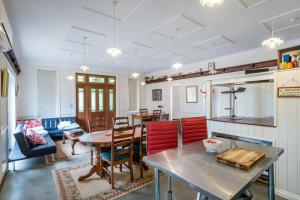 a kitchen and living room with a table and chairs at Studio in Ashgrove in Brisbane