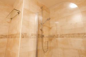 a shower with a glass door in a bathroom at Updated & central 2 bedroom Chester apartment - for up to 6 in Chester