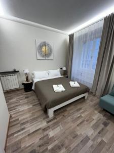 Ліжко або ліжка в номері Le Colonne Di San Luca