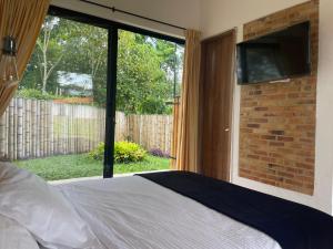 Postel nebo postele na pokoji v ubytování Ecohotel Alma