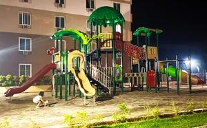 a playground at a building with at Private studio unit with balcony near the beaches in Lapu Lapu City