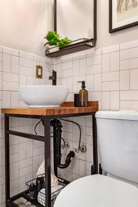 a bathroom with a sink and a toilet at Roami at Tower Hotel in Miami