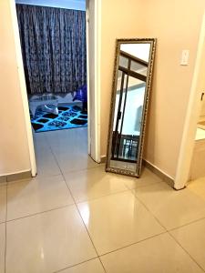 a mirror sitting on the floor in a room at BEST APARTMENTS in Mbabane