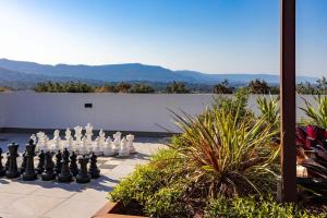 a giant chessboard is sitting on a patio at Hidden Gem on Loftus in Wollongong