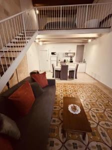 a living room with a couch and a table at Casa Cara in Birgu