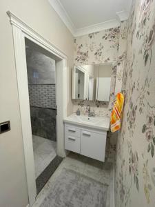 a bathroom with a sink and a shower at Fuays Villa Premium in Trabzon +33 photos