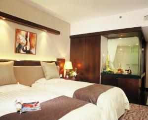 Postel nebo postele na pokoji v ubytování Xiyuan Hotel