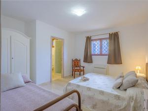 Posteľ alebo postele v izbe v ubytovaní Sardinia Family Villas - Villa Brunilde with private pool
