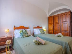 Vuode tai vuoteita majoituspaikassa Sardinia Family Villas - Villa Brunilde with private pool