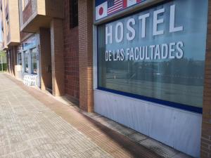 a hospital sign in the window of a building at Hostel de las Facultades in Santander