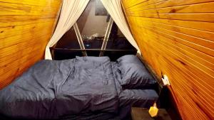 a small bed in a tent in a room at Viewscape in Nuwara Eliya