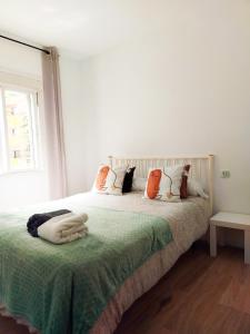 Ένα ή περισσότερα κρεβάτια σε δωμάτιο στο Madrid Homely Apartment