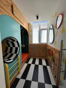 a room with a bus with a checkered floor at Apartment with nice balcony in Guatemala