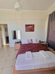 Letto o letti in una camera di Kalogria Beach Apartments