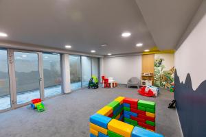 a childs room with a lego couch and chairs at Apartament 6M Rewal w cenie basen, jacuzzi, siłownia, sala zabaw, free private parking, Park Rozrywki HOSSOLAND 30 minut in Rewal