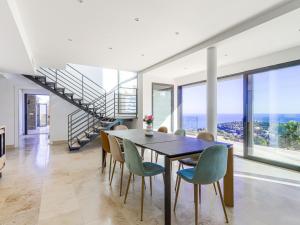 a dining room with a table and chairs at Villa La Concorde by Interhome in Roquebrune-Cap-Martin