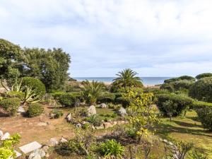 a garden with a view of the ocean at Holiday Home Casa Samba by Interhome in Sainte-Lucie de Porto-Vecchio
