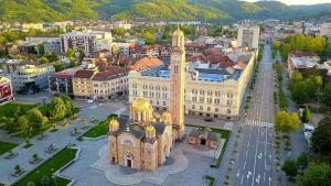 an aerial view of a city with a large building at Apartman Maja in Banja Luka